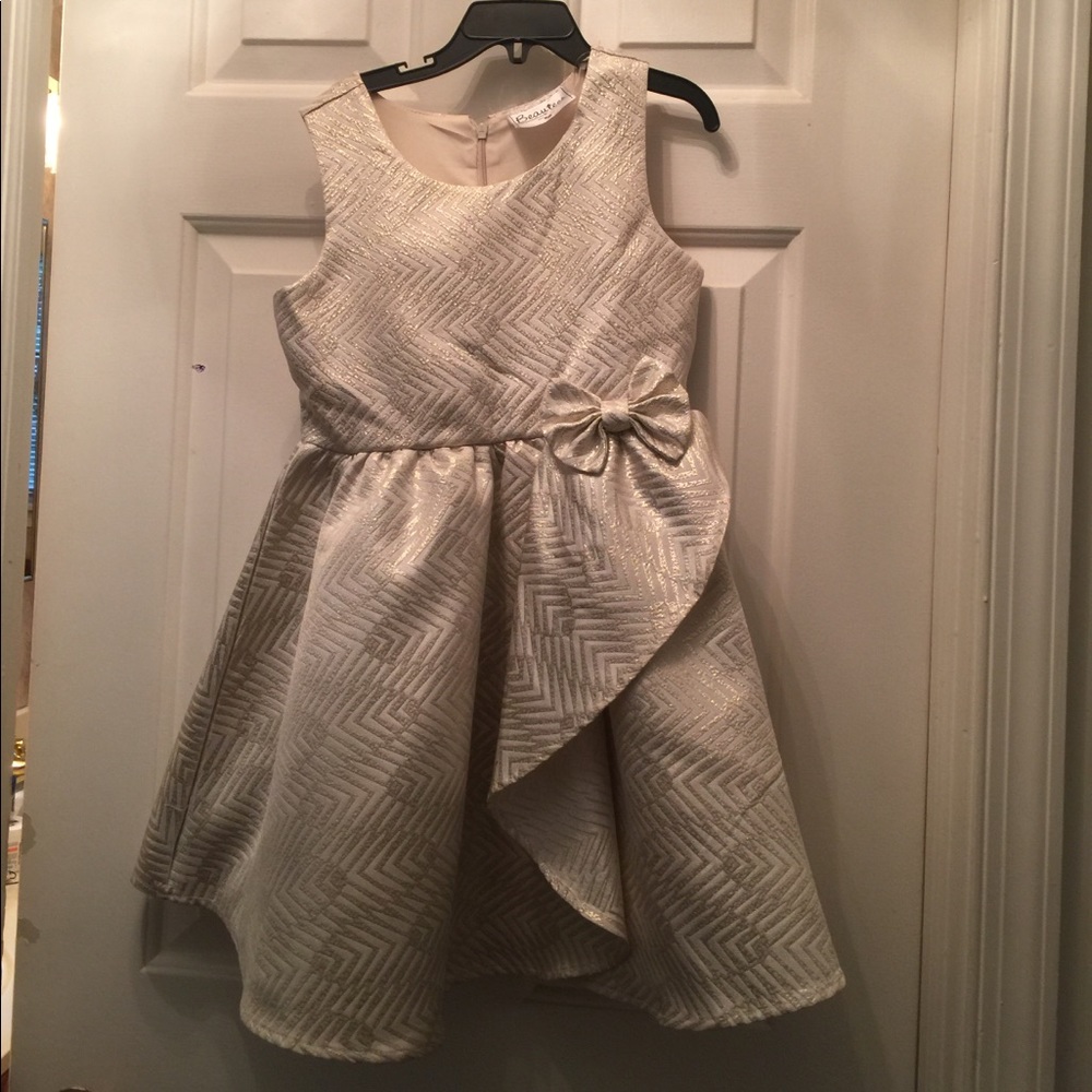 Beautiful gold dress with ruffle and bow